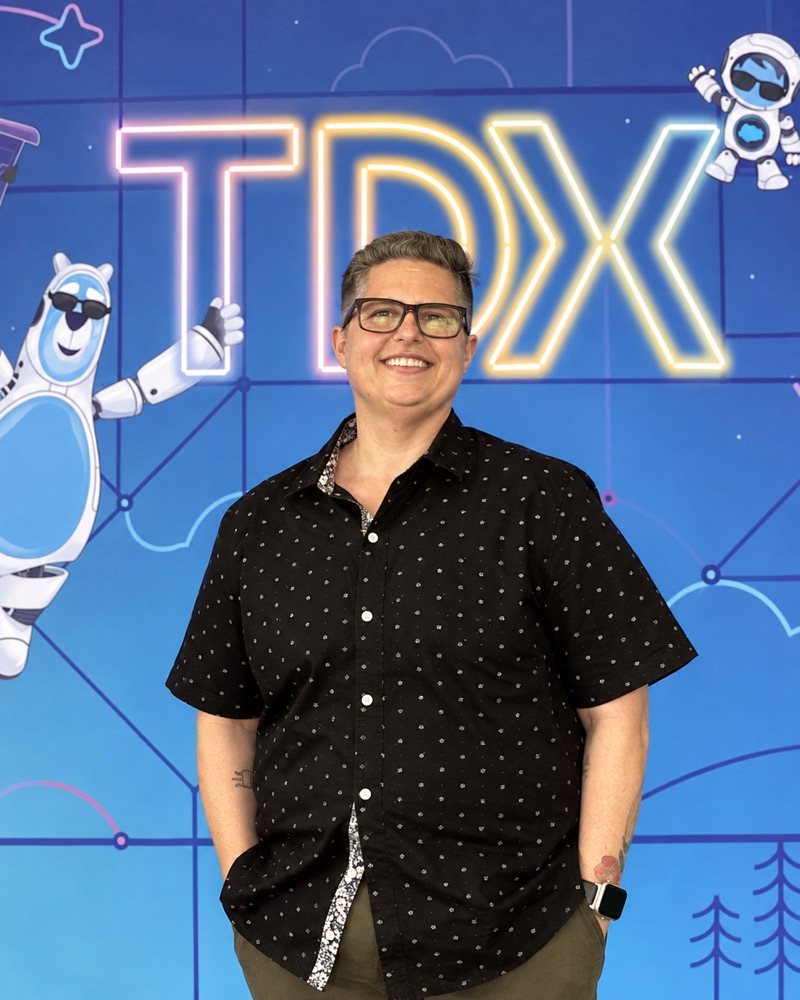 De DeFilippis smiling at Salesforce TDX.